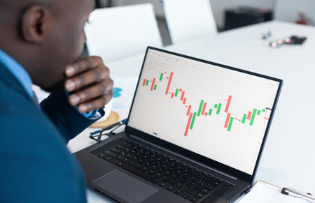 african Businessman Investment Entrepreneur Trading working on Laptop Stock market exchange...