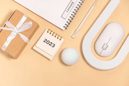 Desktop calendar for 2023 on a beige background. goals and plans on next year.
