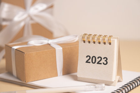 Desktop calendar for 2023 on a beige background. goals and plans on next year.の写真素材