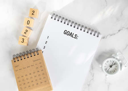 New year goals 2023, goals list with notebook. Resolutions, plan and goals, checklist concept. New Year 2023 template, copy spaceの写真素材