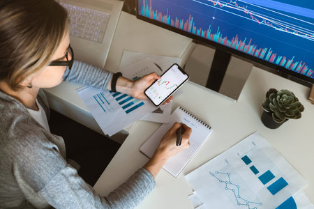 top wiev business woman trader analyzing financial chart. cryptocurrency stock market on pc and...