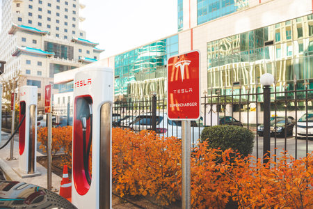 Astana, Kazahstan - October 15, 2022: electric car Tesla charging on supercharging stationのeditorial素材