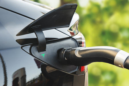Astana, Kazahstan - October 15, 2022: electric car Tesla charging on supercharging station, close upのeditorial素材