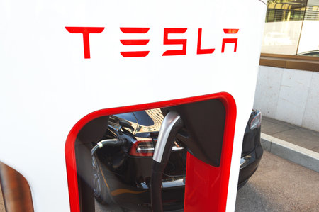 Astana, Kazahstan - October 15, 2022: electric car Tesla charging on supercharging stationのeditorial素材