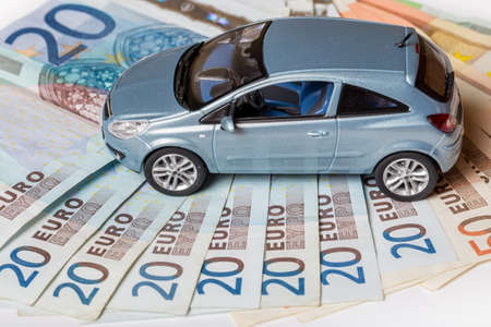 Toy car on moneyの写真素材