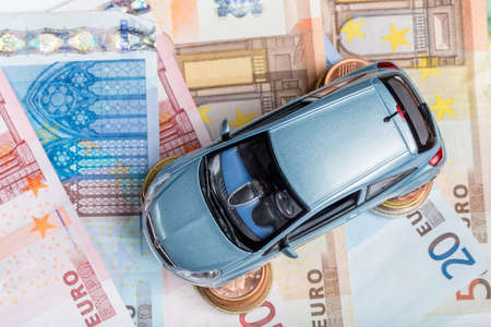 Toy car on money  top viewの写真素材