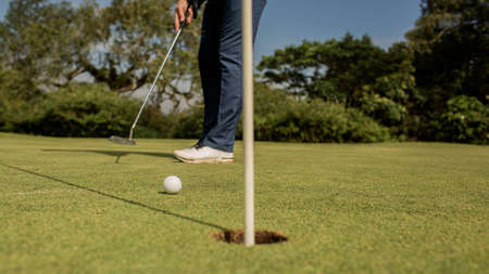 Close-up of a golf holeの写真素材