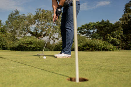 A person holding a golf clubの写真素材