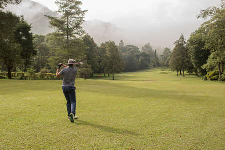A person playing golf.の写真素材