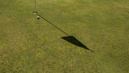 Close-up of a golf holeの写真素材