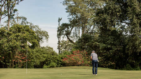 medium shot. Professional golfer goes to do a kickの写真素材
