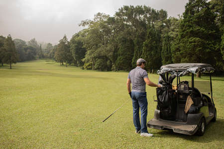 A person playing golf.の写真素材
