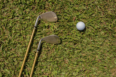 The background. golf clubs and ballsの写真素材