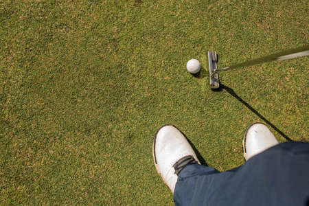A person playing golf.の写真素材
