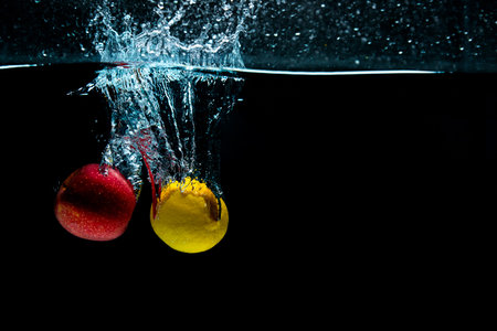 close-up. object shooting. apple with lemon in water