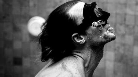 sporty man swimming in mask in poolの写真素材