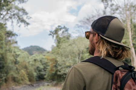 tourist walks through the woodsの写真素材