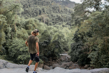 the photographer walks over the rocks