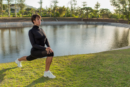 girl doing warm-up in the parkの写真素材