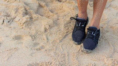 close-up. sneakers on the sand.の写真素材