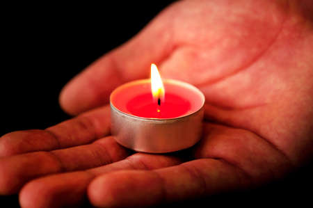 Group of candles burning on blackの写真素材