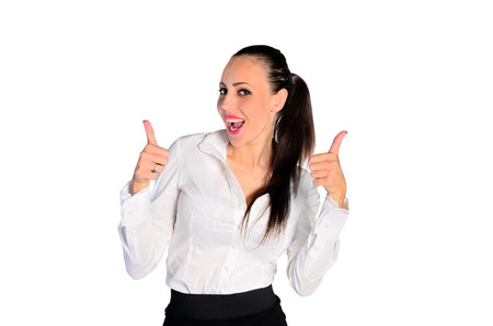 young woman showing thumbs up on white backgroundの写真素材