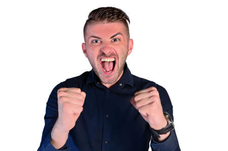 young man shouting victory on white backgroundの写真素材