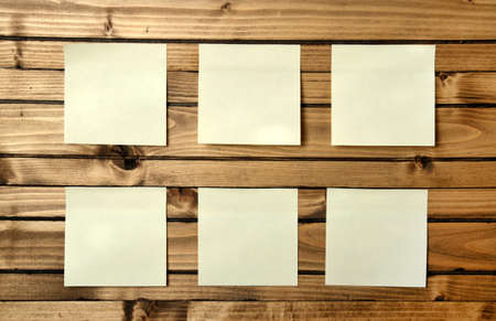 six blank postnote on wood backgroundの写真素材