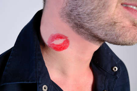 closeup of man with lipstick on neckの写真素材