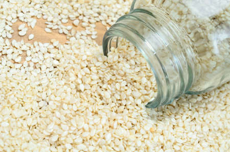 white sesame on wooden tableの写真素材