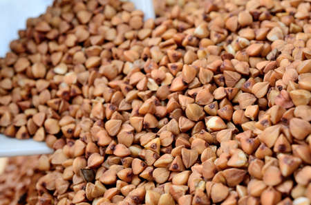 brown buckwheat on wooden tableの写真素材