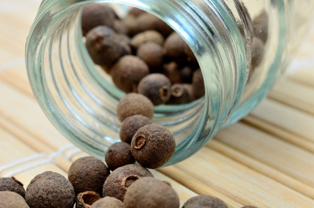 allspice on wooden table