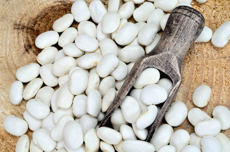 white beans on wooden table