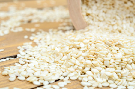 white sesame on wooden table