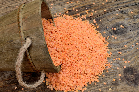 red lentil on wooden tableの写真素材