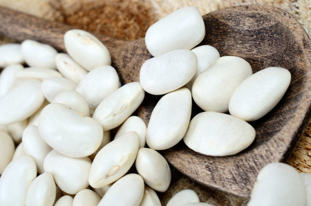 white beans on wooden table