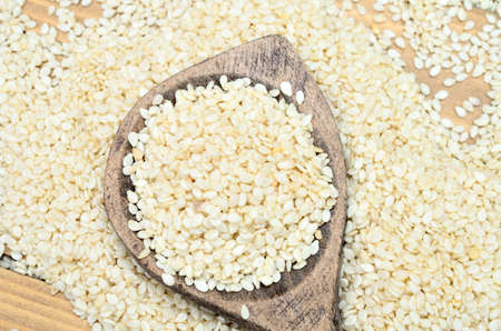 white sesame on wooden tableの写真素材