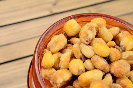 yellow corn on wooden tableの写真素材