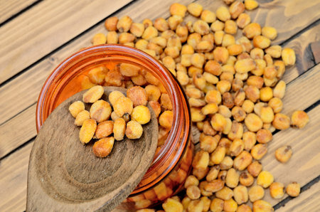 yellow corn on wooden tableの写真素材