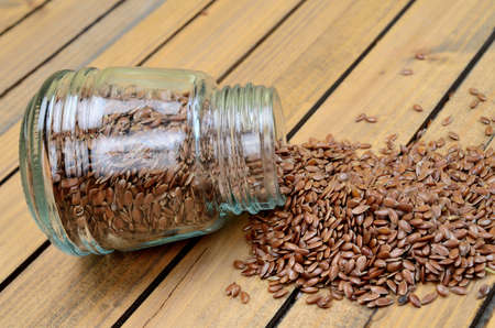 flax seed on wooden tableの写真素材