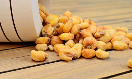 yellow corn on wooden tableの写真素材