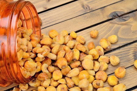 yellow corn on wooden tableの写真素材