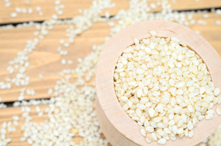 white sesame on wooden tableの写真素材