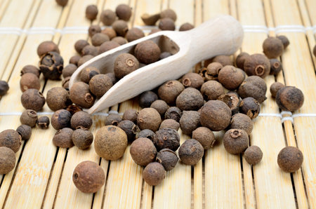 allspice on wooden table