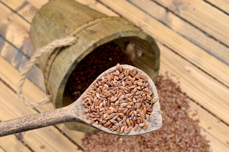 flax seed in wooden spoonの写真素材
