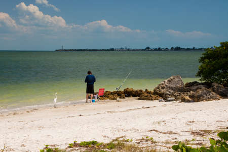 Beach is alone angler fishingの写真素材