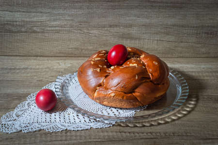 Easter traditional bread, greek tsoureki and red eggsの写真素材