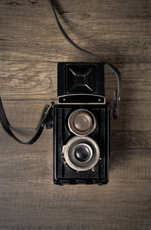 Vintage camera on wooden background
