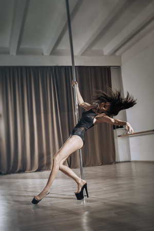 Girl pole dancer on training.の写真素材