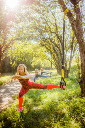 Outdoor exercises on fitness straps